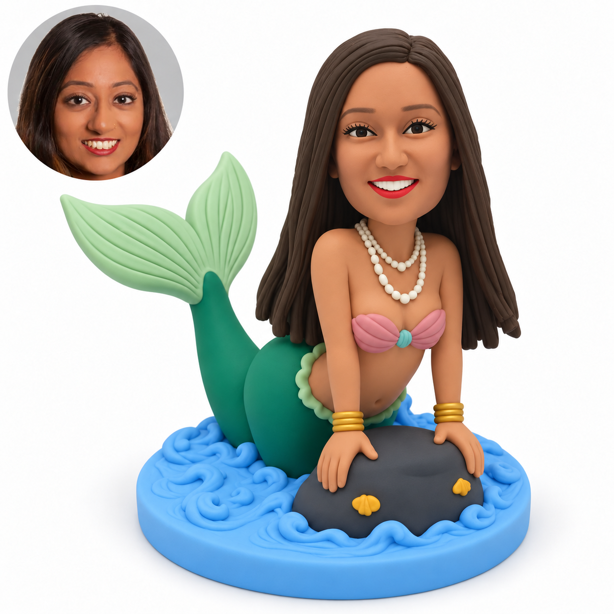 custom bobblehead figure female mermaid leaning forward with both hands on a rock and her tail raised behind her