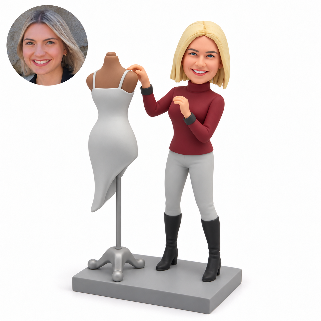 custom bobblehead figure female fashion designer beside a dress form with both hands raised