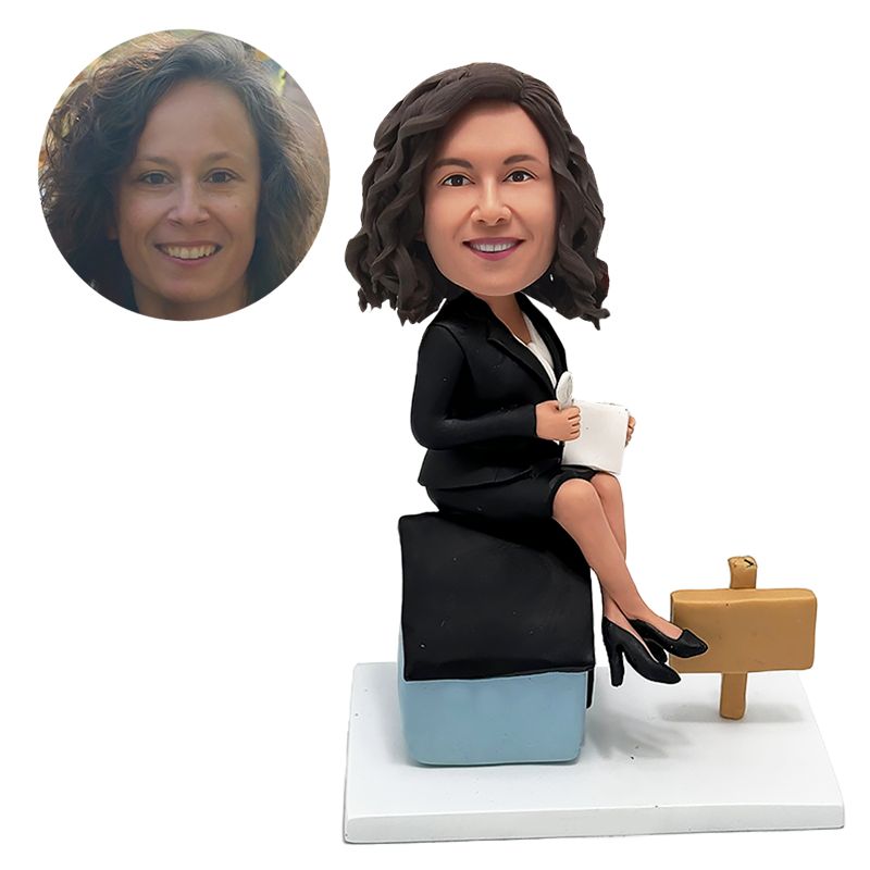 custom made bobblehead office lady holding a pen with a house