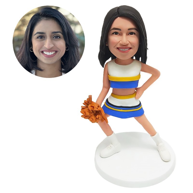 bobble head figurine cheerleader holding a cheerball