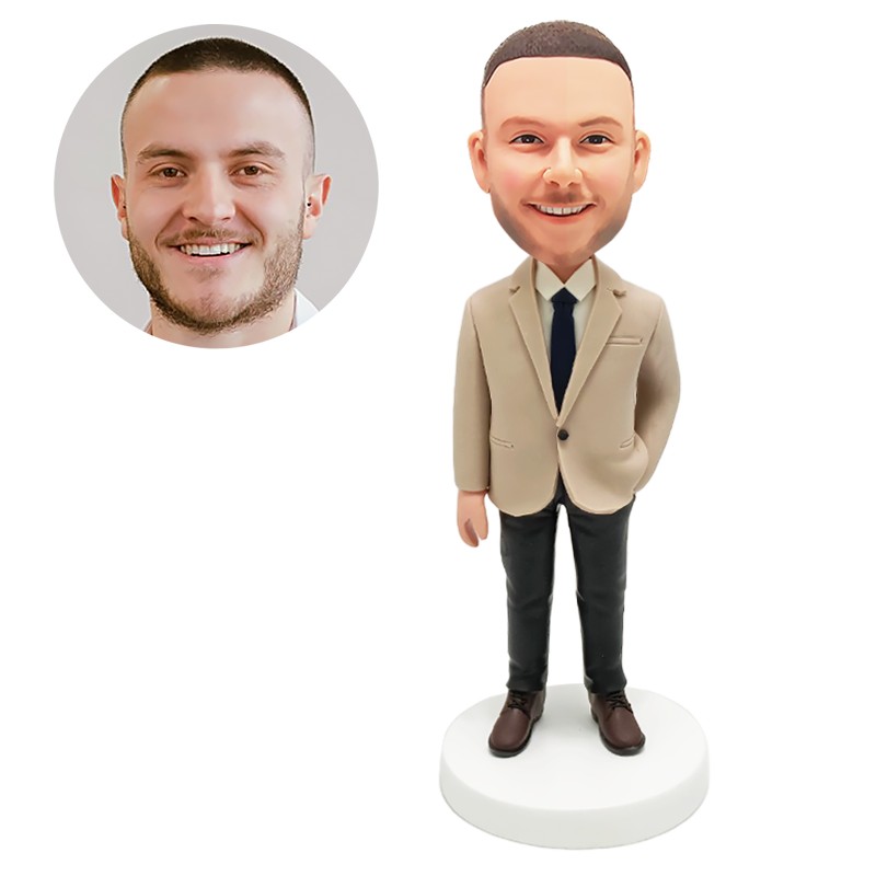 bobble head figurine business man with one hand in pocket