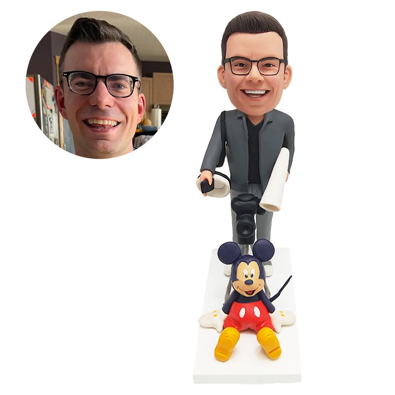 custom bobblehead figurine photographer holding a camera with a mickey mouse