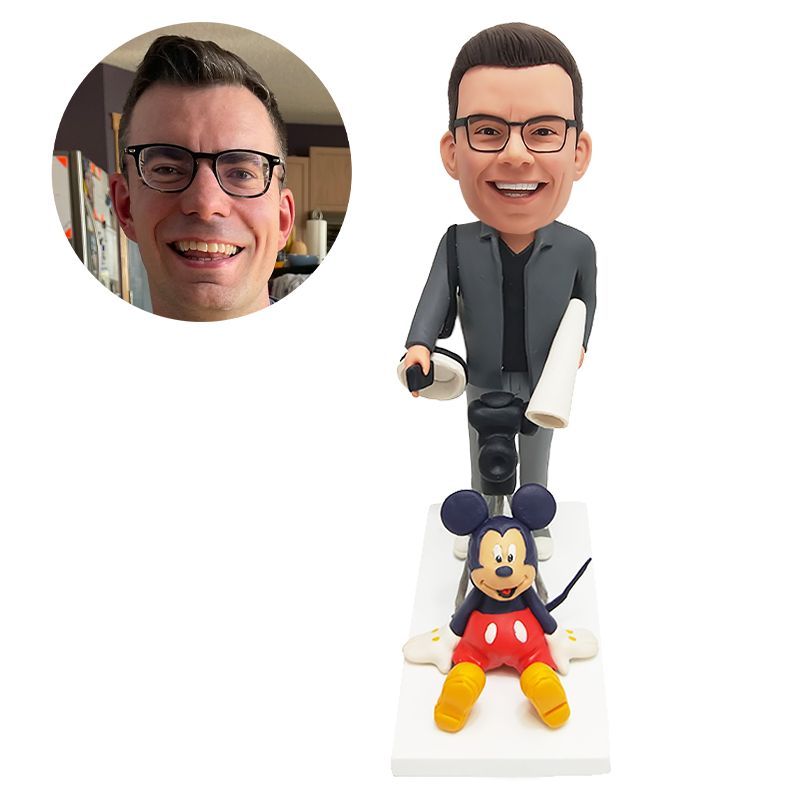 custom bobblehead figurine photographer holding a camera with a mickey mouse