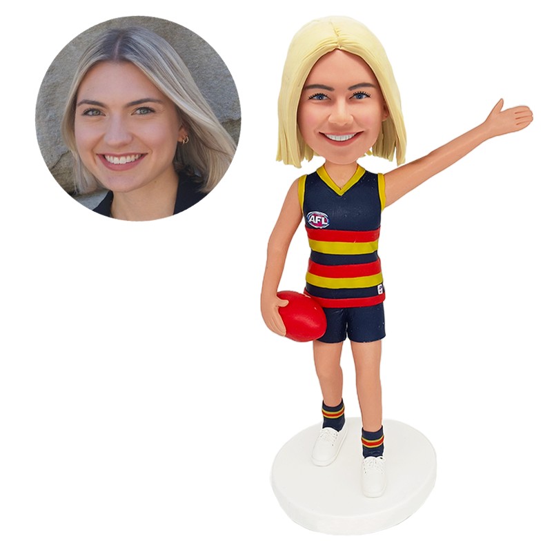 bobble head figurine female player holding a football