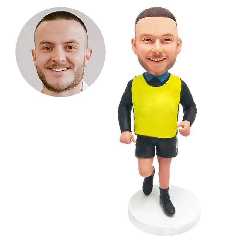 bobble head figurine male coach running in a fluorescent vest
