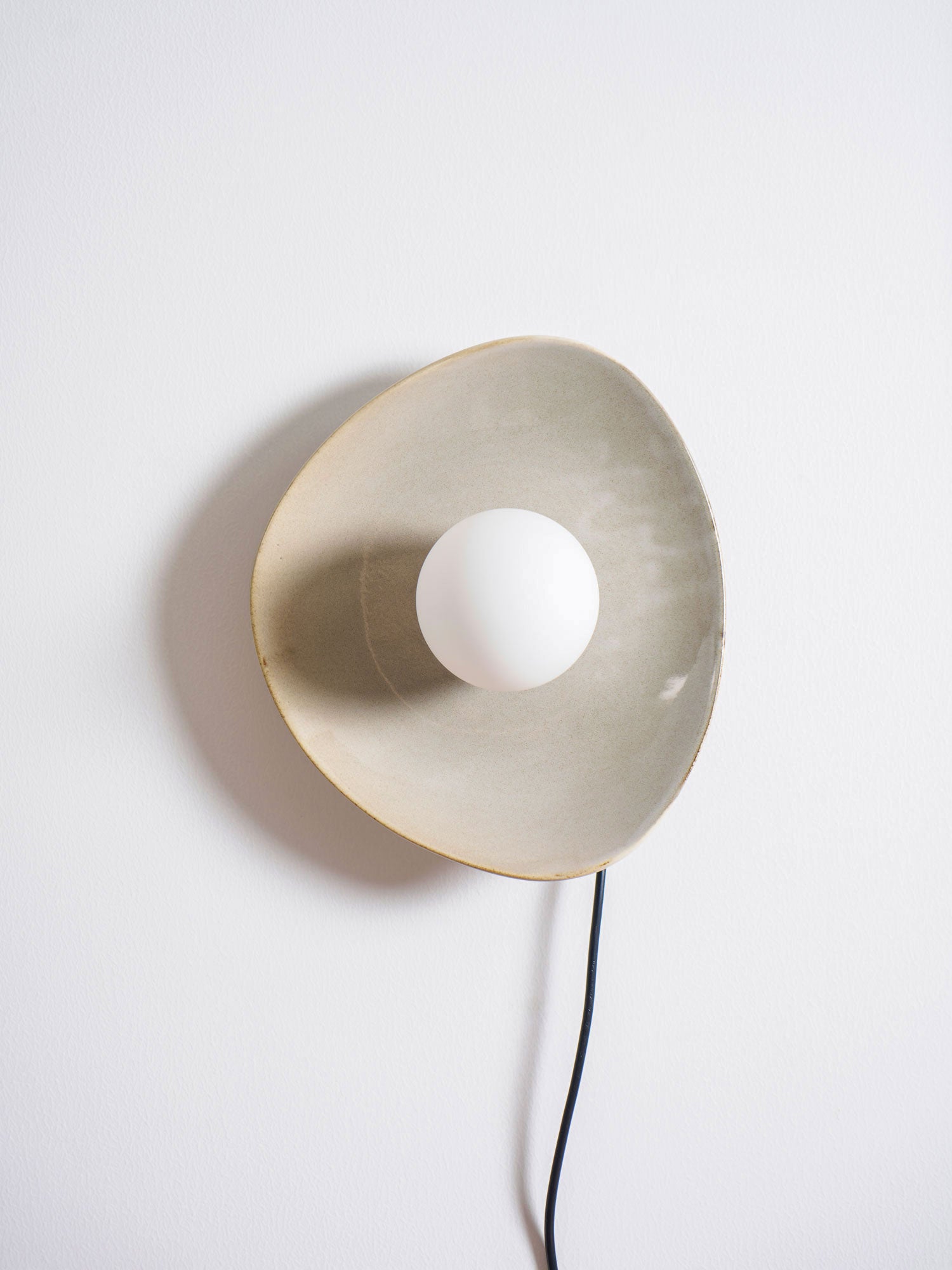 Pebble Disc Plug-in Aplique