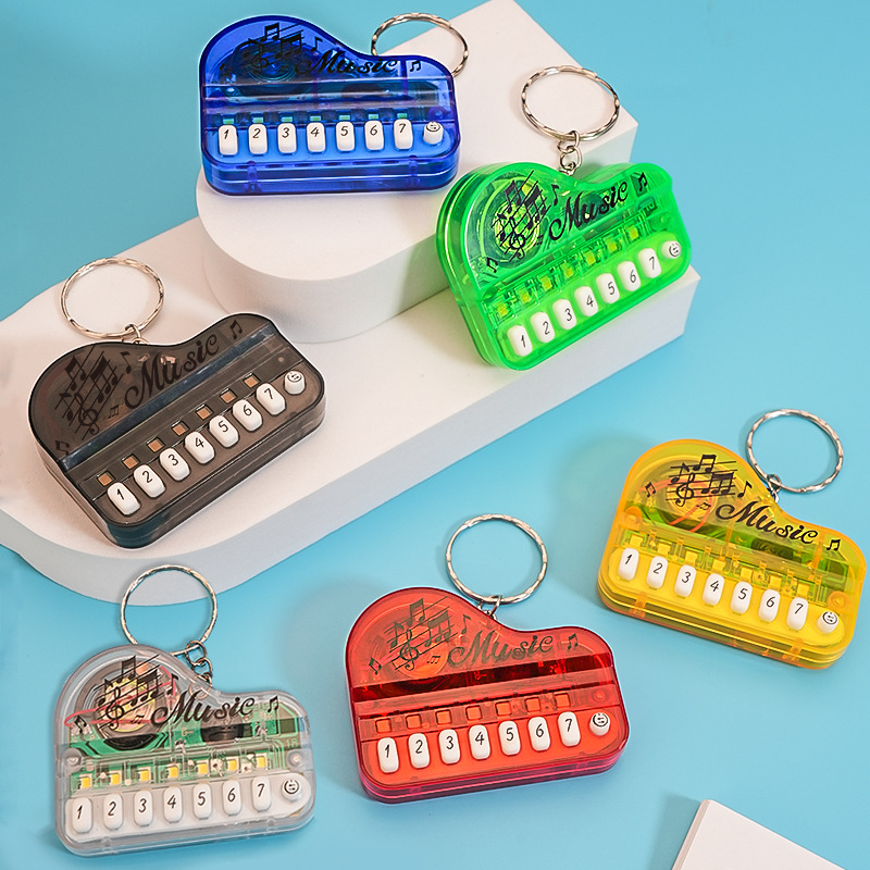 Mini Electronic Piano Keychain Creative Handheld Piano Luminous Music Bag Pendant