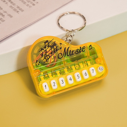 Mini Electronic Piano Keychain Creative Handheld Piano Luminous Music Bag Pendant