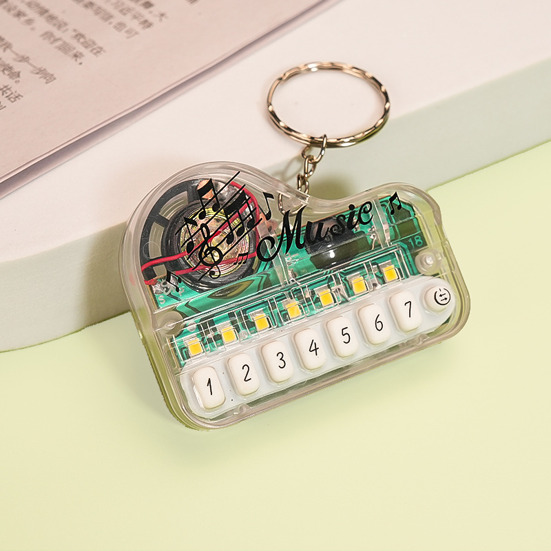Mini Electronic Piano Keychain Creative Handheld Piano Luminous Music 