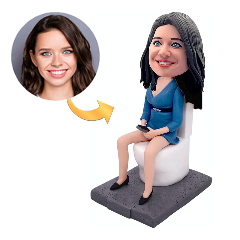 Funny Bobblehead of a Woman Sitting on the Toilet in Blue Dress