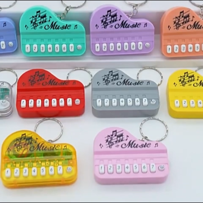 Mini Electronic Piano Keychain Creative Handheld Piano Luminous Music Bag Pendant