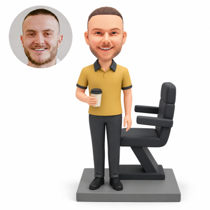 custom bobblehead figure male boss standing with a takeaway coffee beside a high-backed chair on an angled pedestal