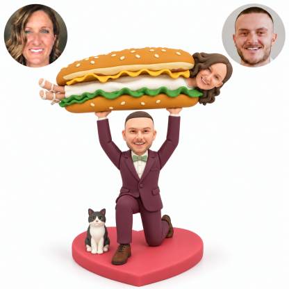 custom bobblehead figures kneeling groom lifting the bride in a long sandwich costume overhead with a fixed cat accessory