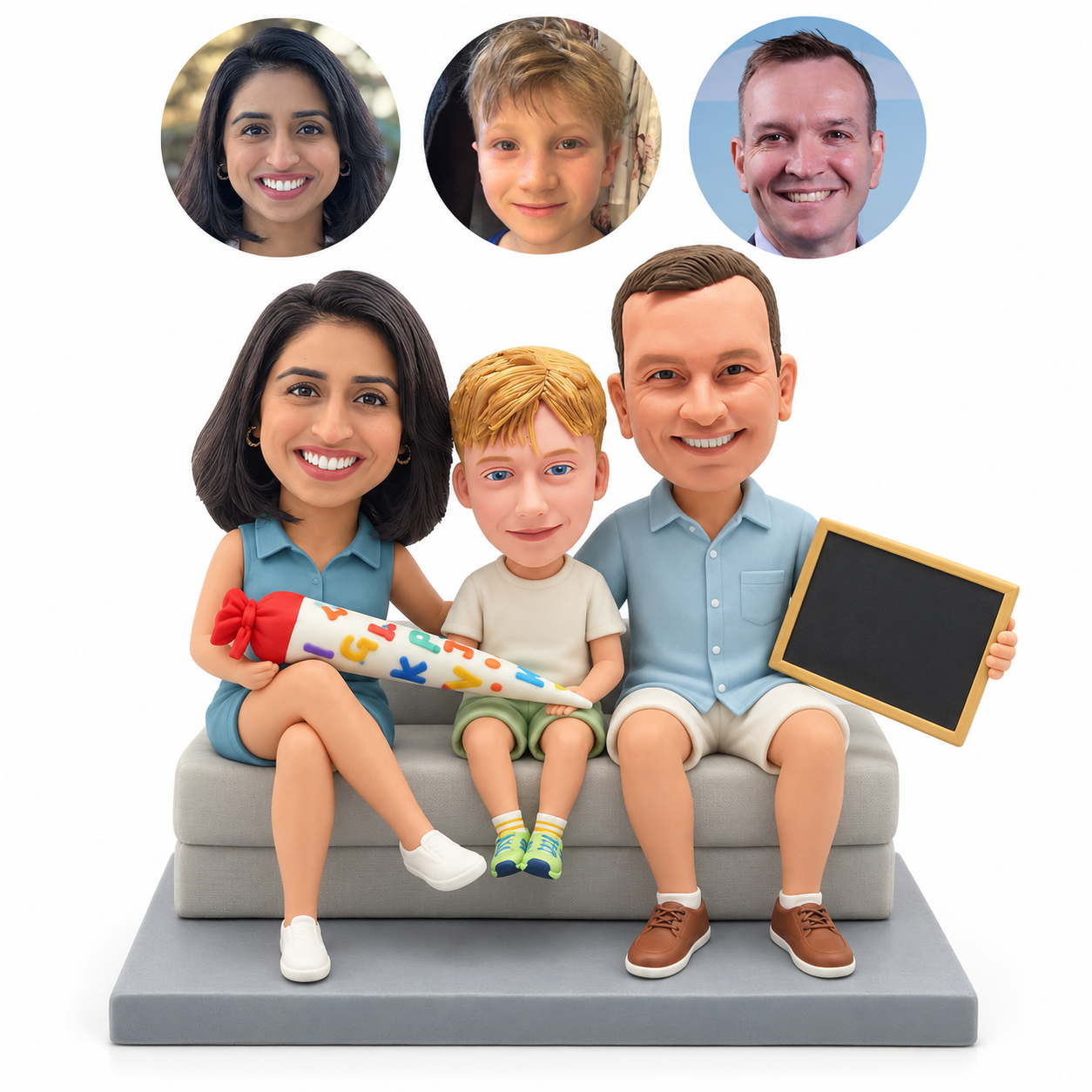 custom bobblehead figures mother father and son seated on a sofa with a school cone and a chalkboard