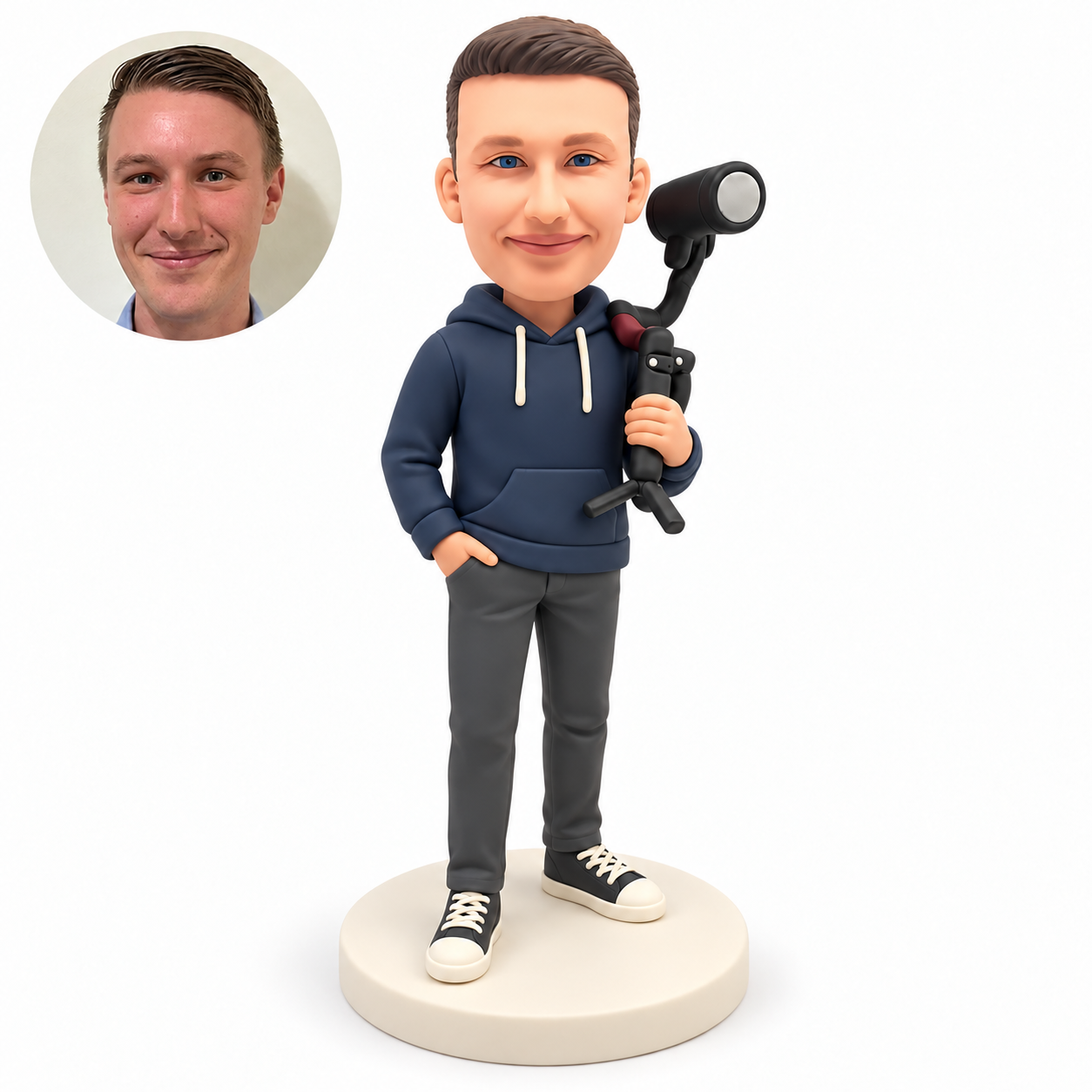 custom bobblehead figure man carrying a camera rig over his left shoulder with one hand in his pocket