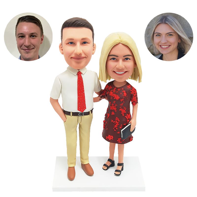 bobble head figurine couple with handbag