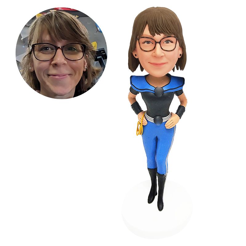 bobble head figurine superhero with hands on the hips