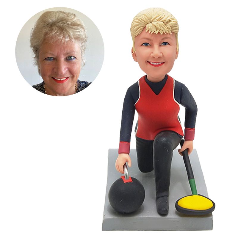 bobble head figurine curling player holding a curling