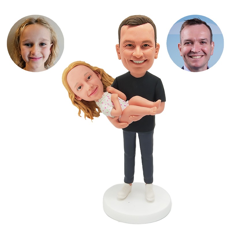 custom bobblehead father holding a baby