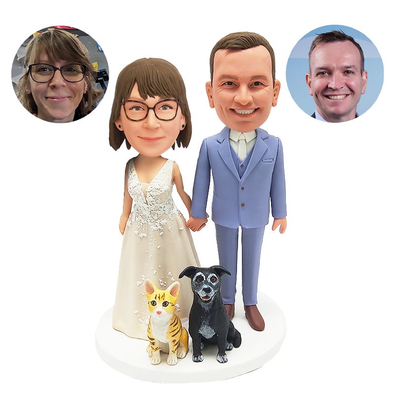 bobble head figurine couple holding hands with pets