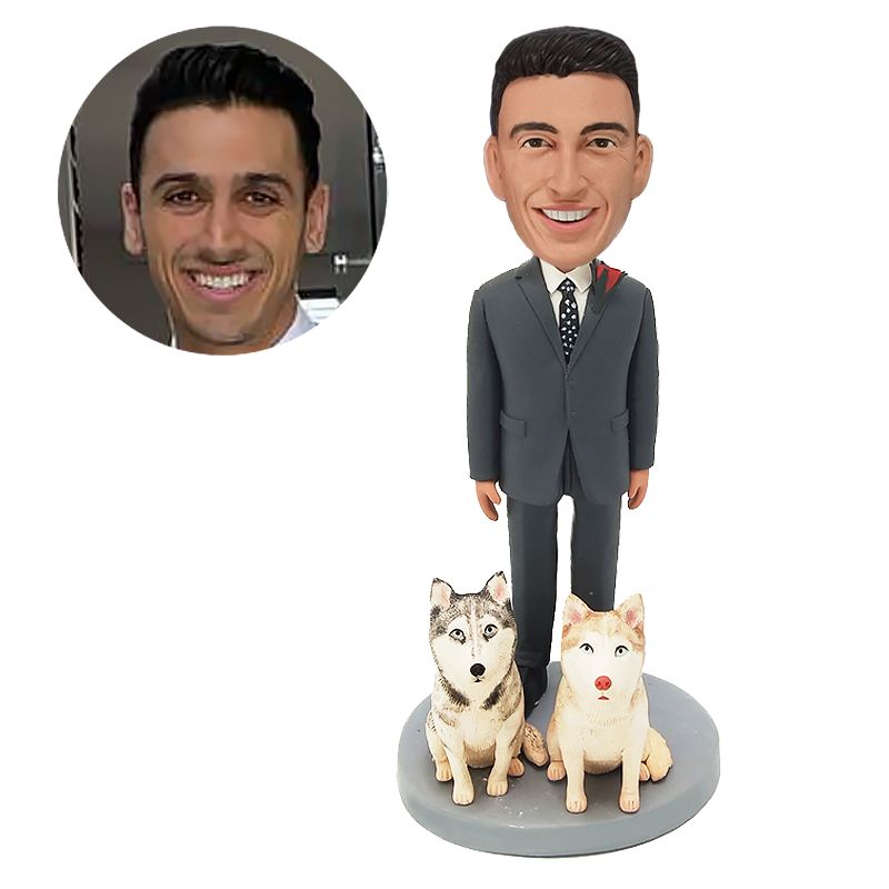 personalized bobblehead businessman in a suit with two dogs