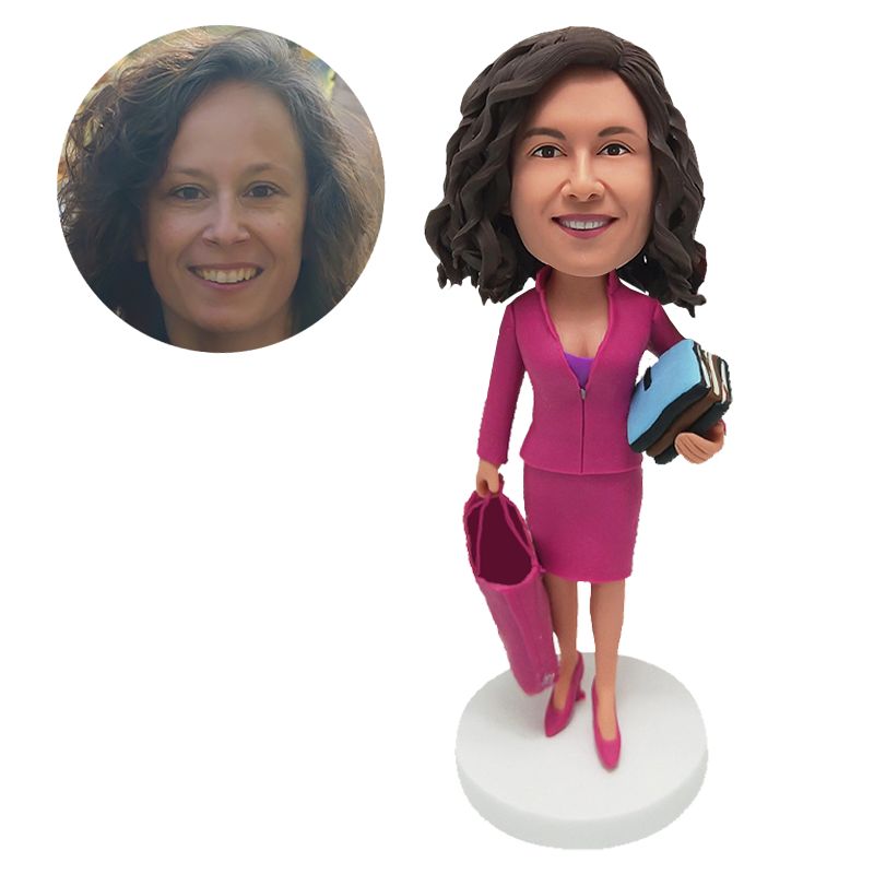 custom made bobblehead female colleague holding a stack of books