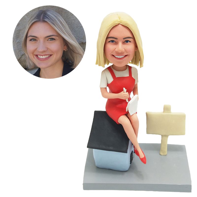 custom bobble head lady writing something on the paper