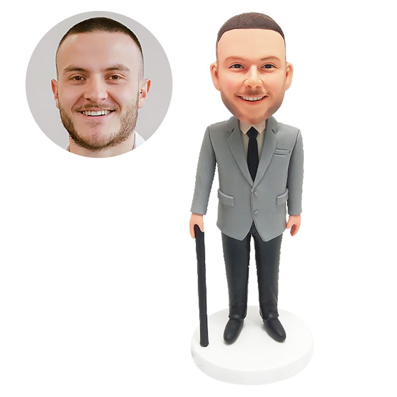 custom bobblehead figure male boss holding a walking stick