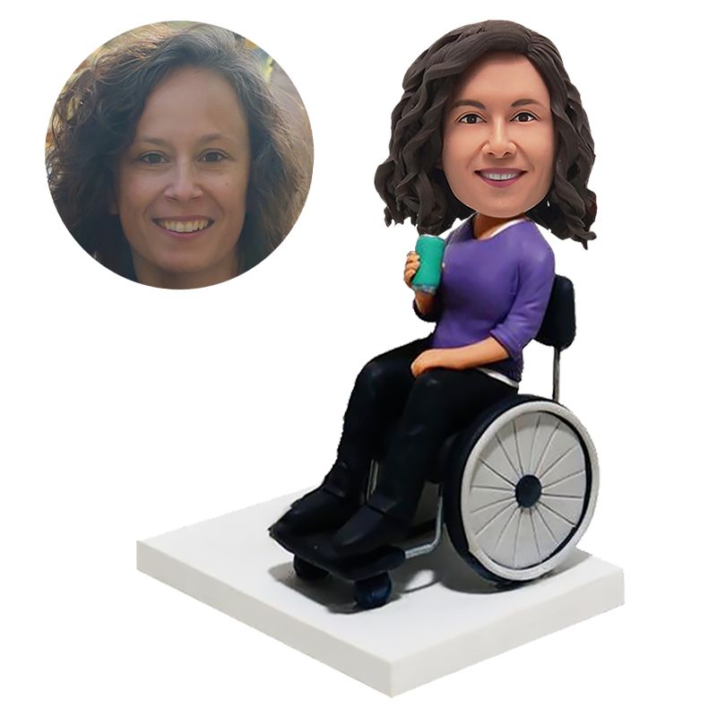 personalised bobble head lady sitting on a wheel with a drink
