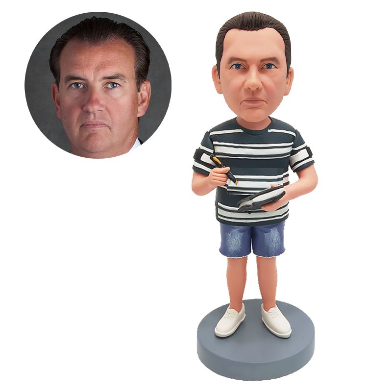 personalised bobble head man writing something on a notebook