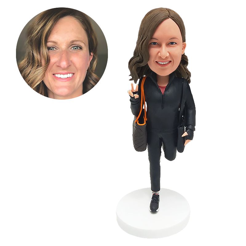 bobble head figurine shopping lady making gesture with a bag