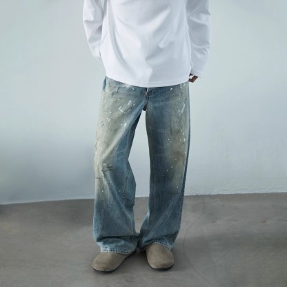 Unisex Vintage American High Street Wide-Leg Distressed Denim Pants – Dropped Hem, Spray-Paint Streaks & Worn-In Design, Street Fashion