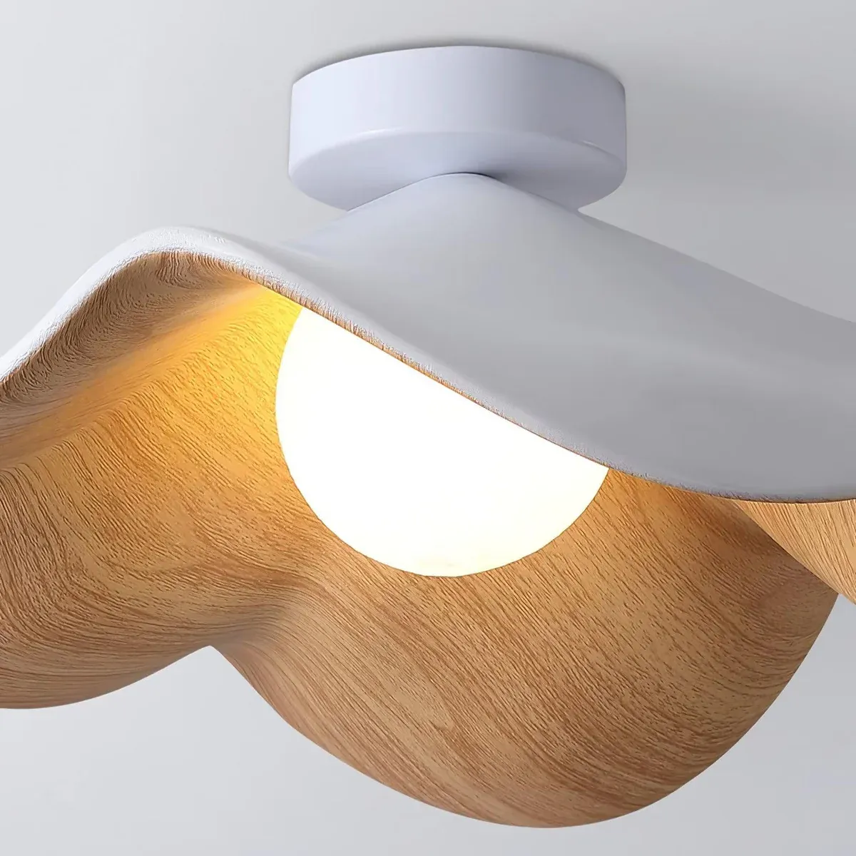 Modern Carins ceiling light with wood grain detail and warm illumination