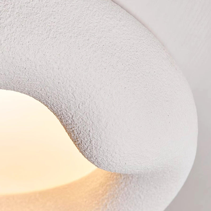 Quinn Ceiling Light: Close-up of textured surface, soft glow