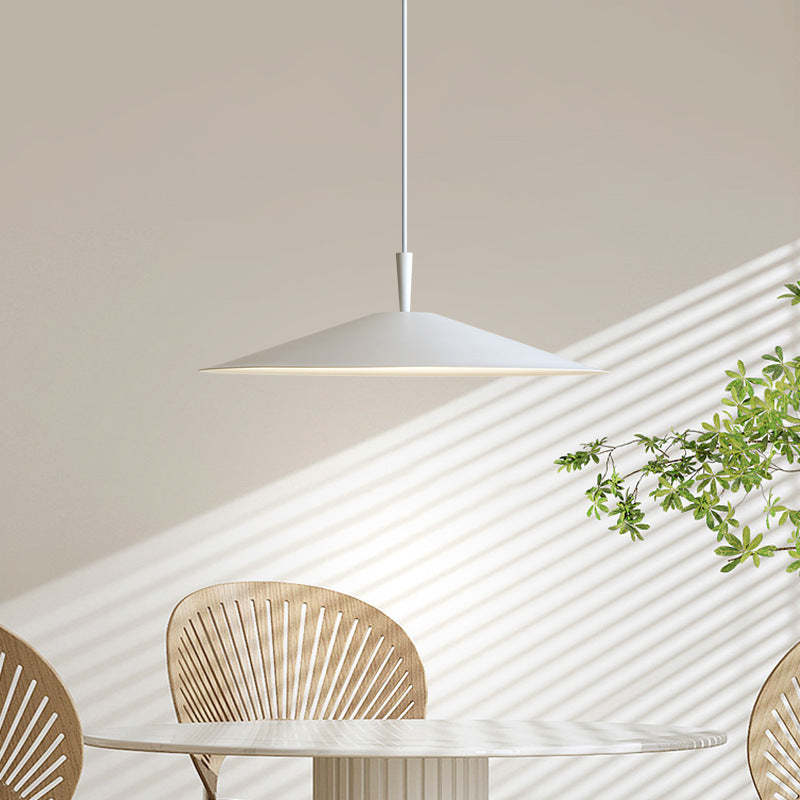 White modern LED pendant light over dining table