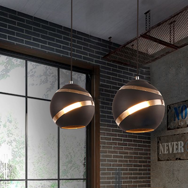 Art Deco globe pendant lights in a modern living room.