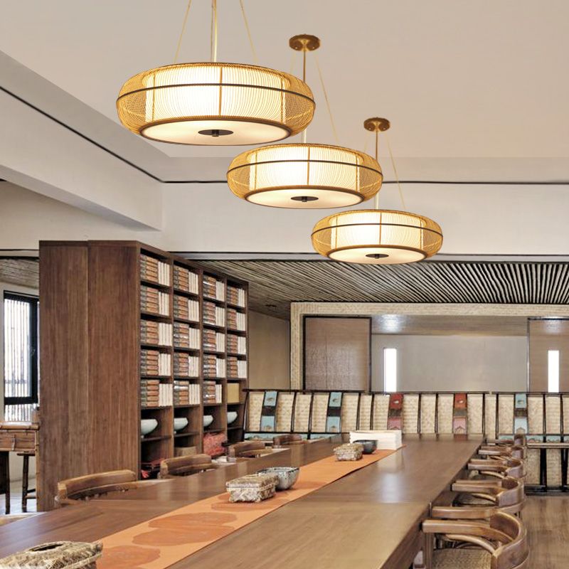 Ozawa wood pendant lights over dining table. Basket weave lighting.