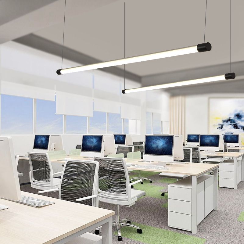 Office illuminated by linear pendant lighting
