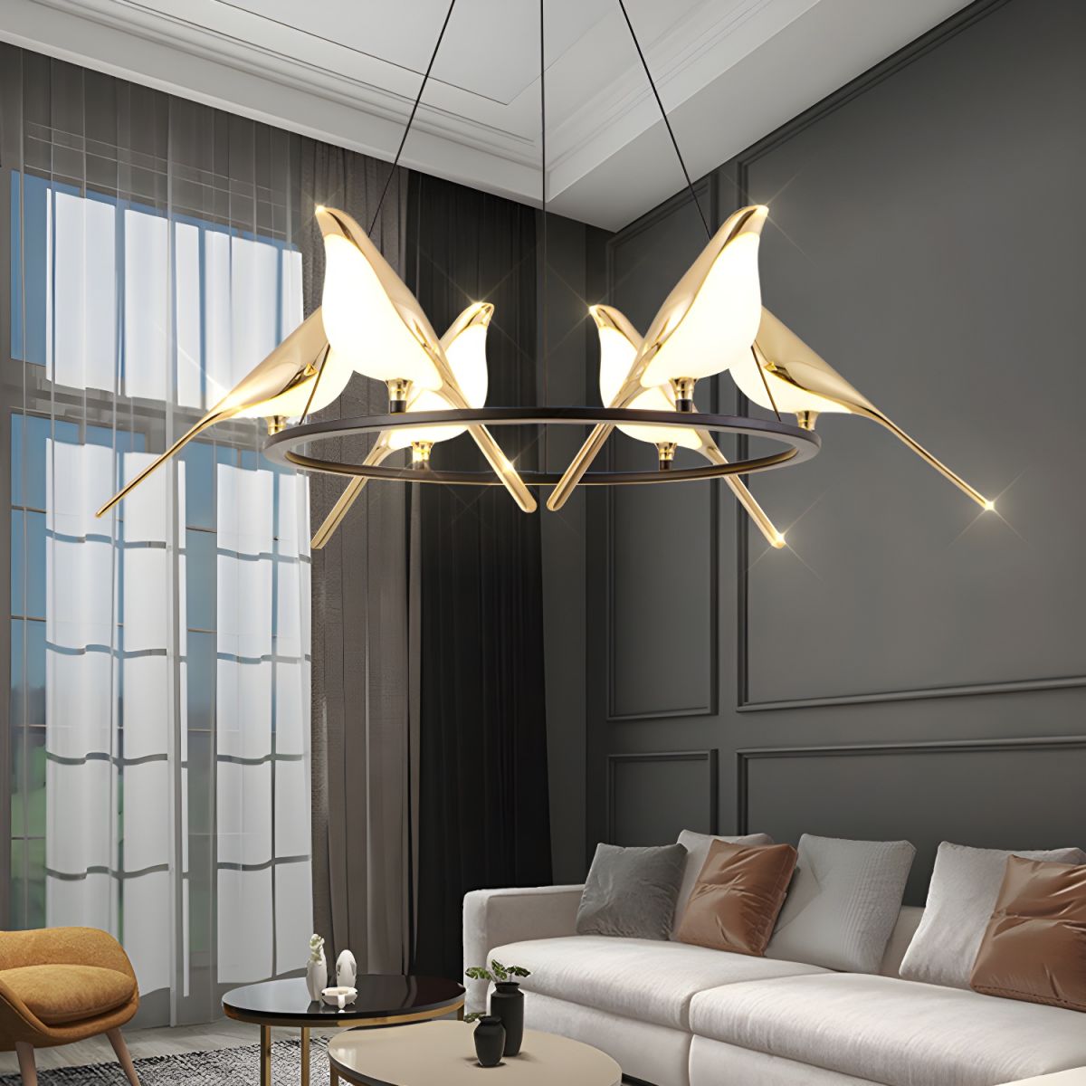 Gold bird pendant light in living room, art deco style.