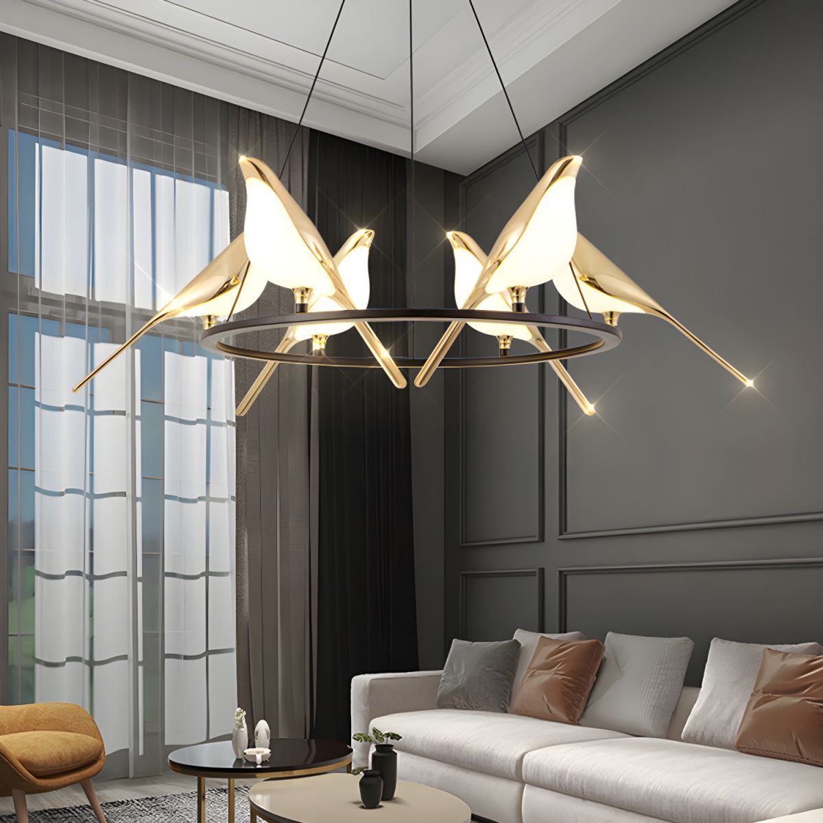 Gold bird pendant light in living room, art deco style.