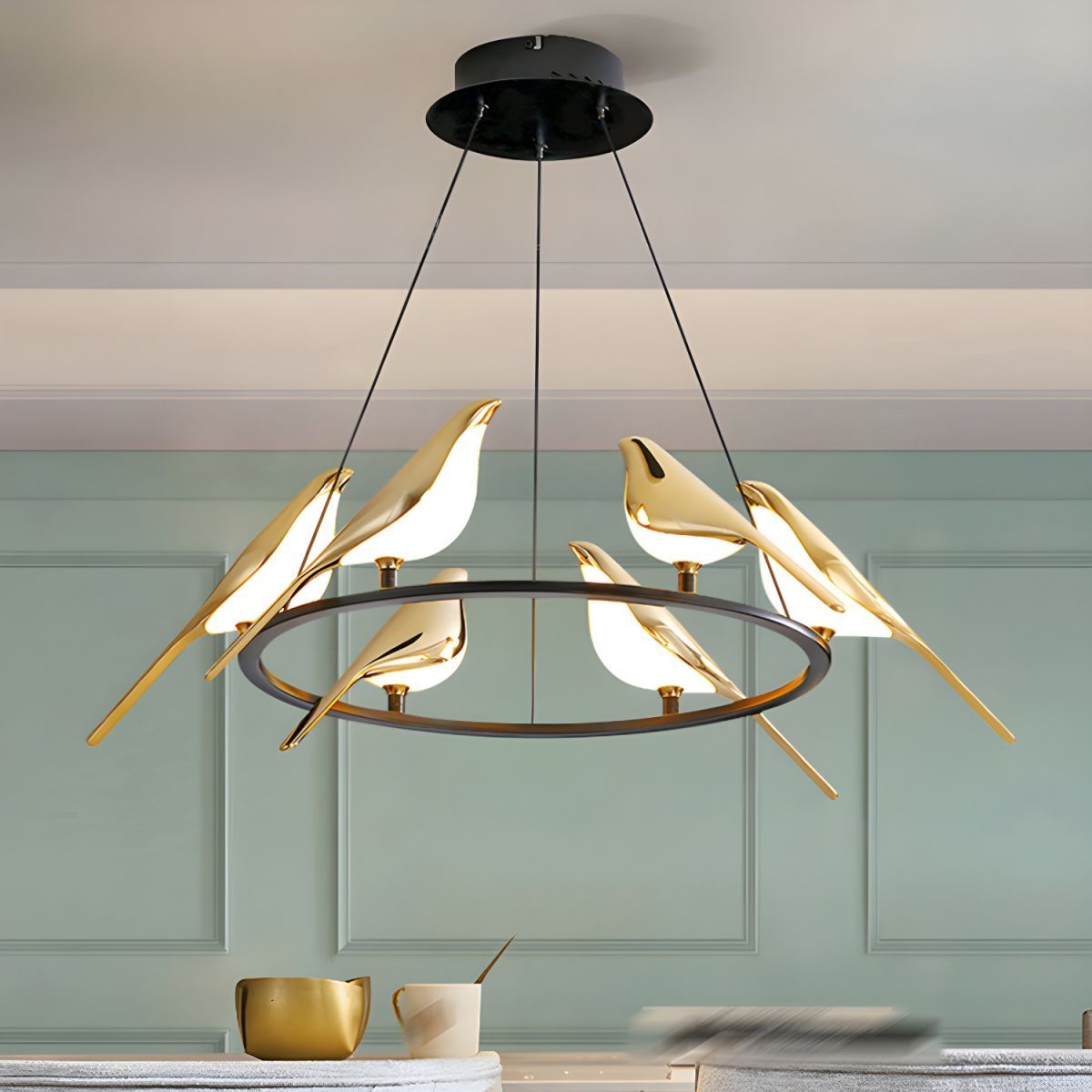 Art Deco bird pendant light. Modern gold finish lighting fixture.