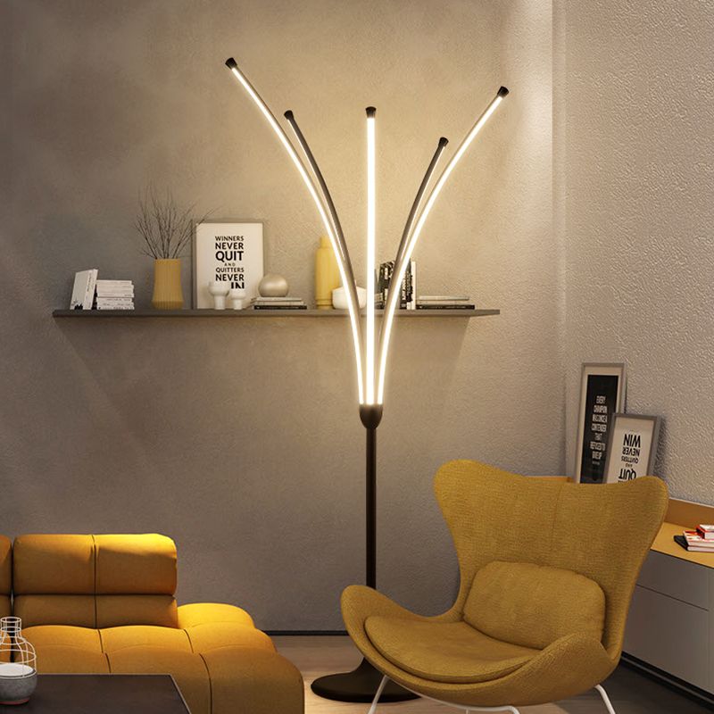 Minimalist tree-like floor lamp in a modern living room setting