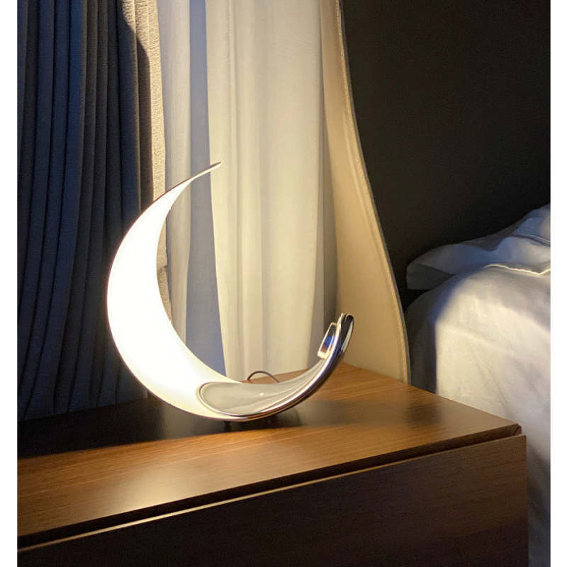 Moon Arc LED Table Lamp on a nightstand.