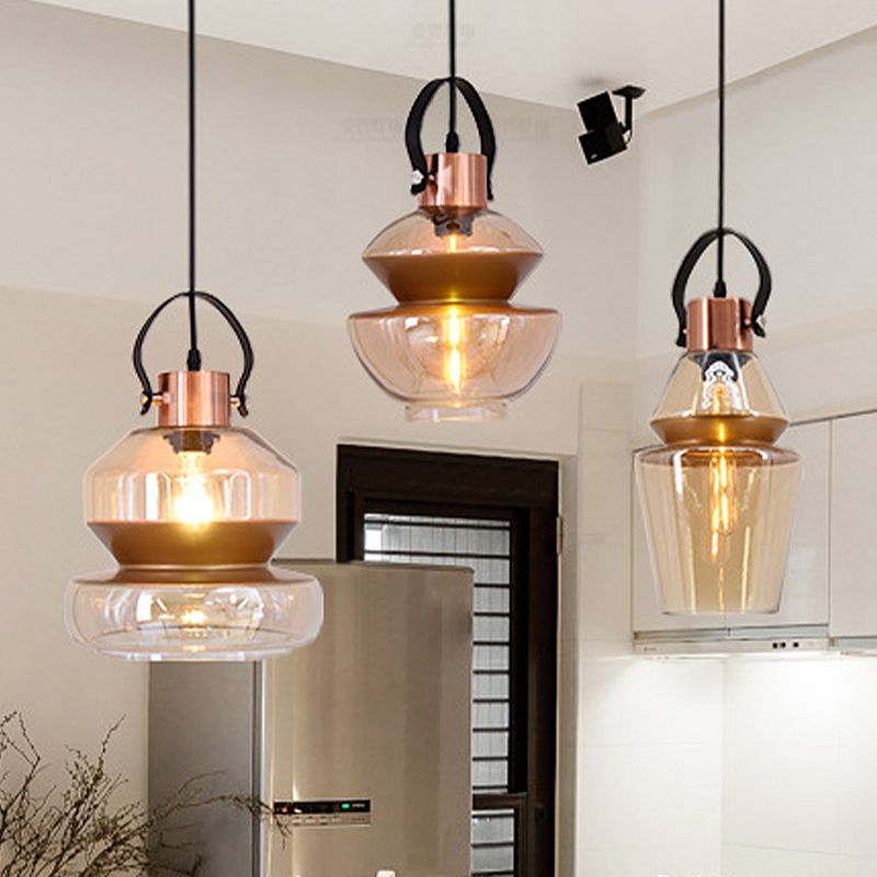 Alessio pendant lighting with amber glass shade.