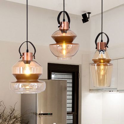 Alessio pendant lighting with amber glass shade.