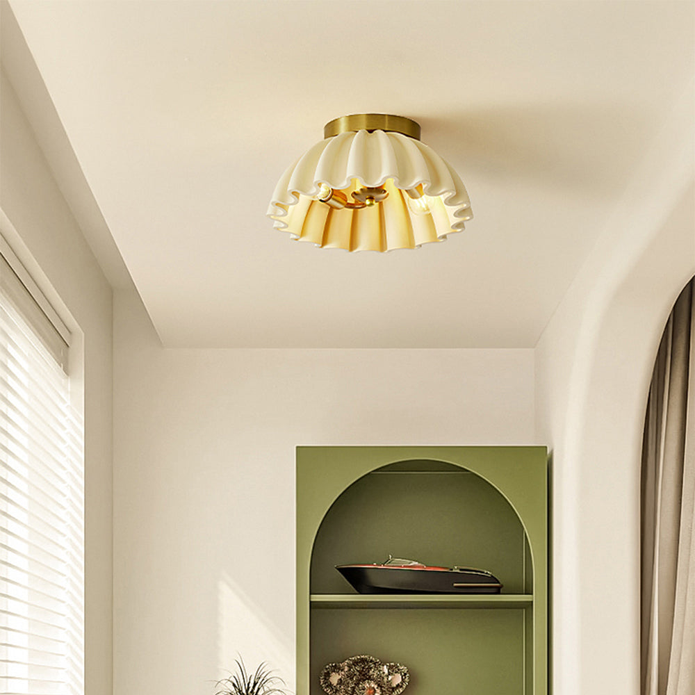 Modern flush mount ceiling light in a white interior setting
