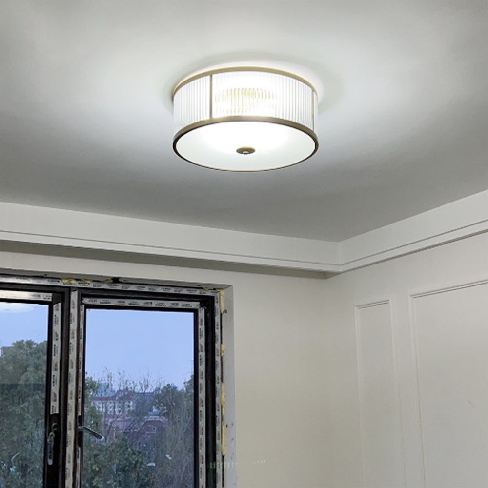 Gold Alessio glass flush mount ceiling light in bedroom