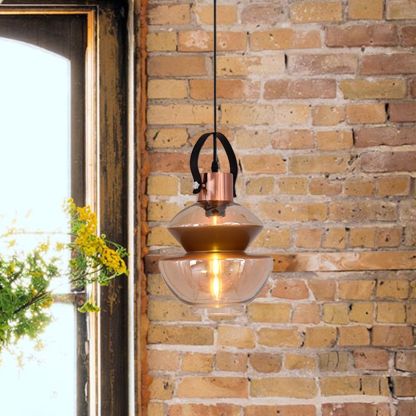 Alessio Pendant Light with amber glass shade on brick wall