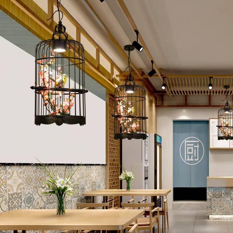 Elegant restaurant interior with Cooley Art Deco birdcage pendant lights