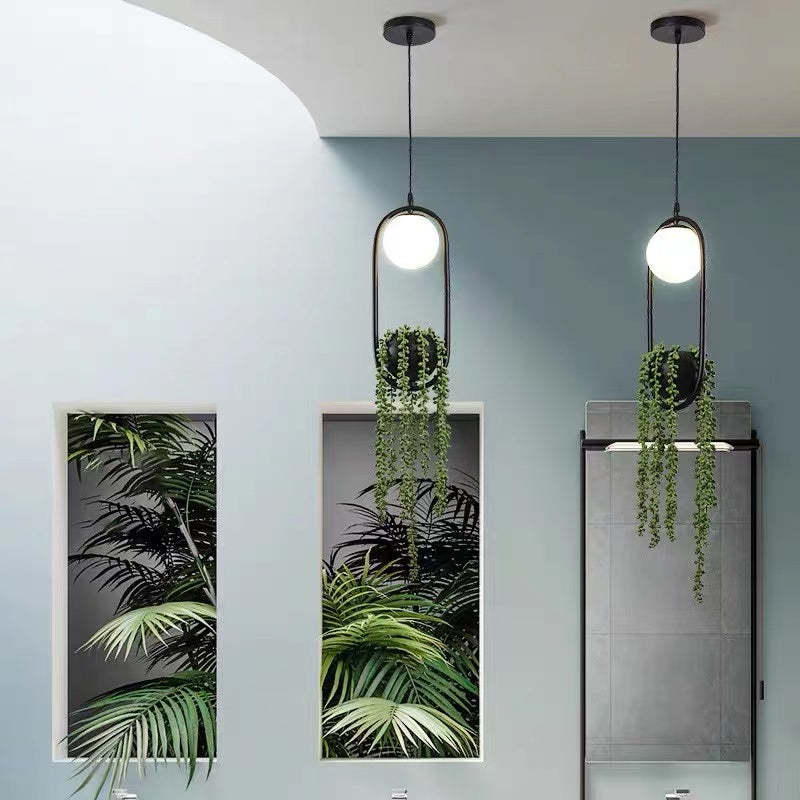 Metal pendant light with plant, Las Sola artistic lighting